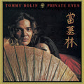 the album cover for Tommy Bolin - Private Eyes