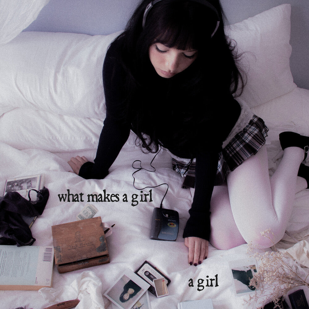 the album cover for Esha Tewari - What Makes A Girl A Girl