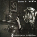 the album cover for David Allan Coe - Standing Too Close To the Flame