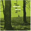 the album cover for Dorothy Ashby  / Wess,Frank - In A Minor Groove - Clear With Red/Green/Purple
